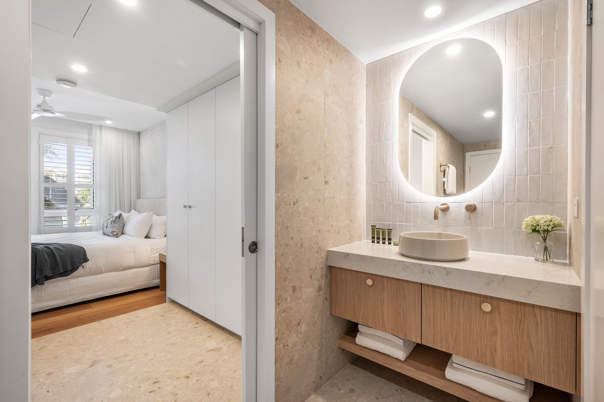Ensuite bathroom with renovated marbled bathroom with modern fixtures